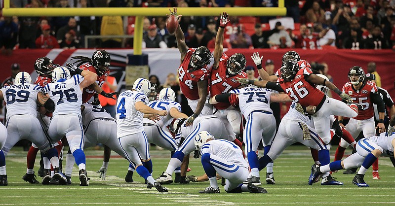 Indianapolis Colts kicker Adam Vinatieri kicks the game-winning field goal during the second of an NFL football game against the Atlanta Falcons, Sunday, Nov. 22, 2015, in Atlanta. The Colts won 24-21.