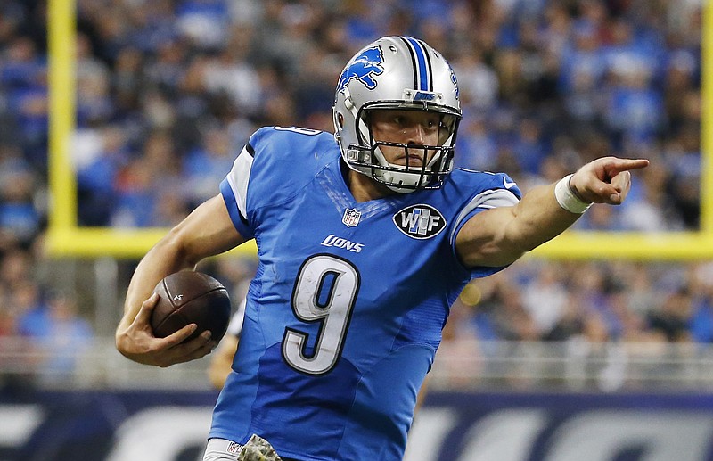 Detroit Lions quarterback Matthew Stafford (9) points as he scrambles during the second half of an NFL football game against the Oakland Raiders, Sunday, Nov. 22, 2015, in Detroit