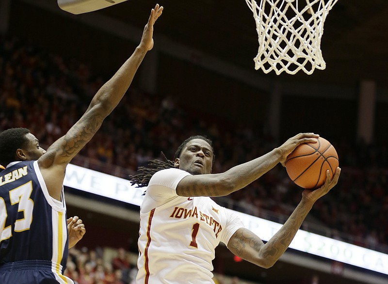 Iowa State forward Jameel McKay, right, drives to the basket past Chattanooga forward Tre' McLean during the first half of an NCAA college basketball game, Monday, Nov. 23, 2015, in Ames, Iowa. (AP Photo/Charlie Neibergall)