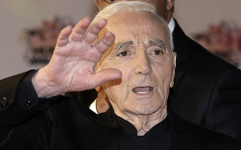 
              FILE - In this Saturday, Nov. 7, 2015 file photo, French singer Charles Aznavour arrives at the Cannes festival palace to take part in the NRJ Music Awards ceremony, in Cannes, southeastern France. Veteran French singer 91 year old Charles Aznavour has postponed two concerts he was scheduled to give in Amsterdam due to health problems. (AP Photo/Lionel Cironneau, File)
            
