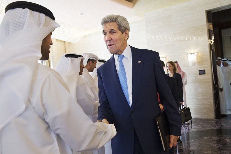 
              U.S. Secretary of State John Kerry greets staff of Abu Dhabi Crown Prince Mohammed bin Zayed Al Nahyan before their meeting at Mina Palace in Abu Dhabi, United Arab Emirates, on Monday, Nov. 23, 2015. (AP Photo/Jacquelyn Martin, Pool)
            