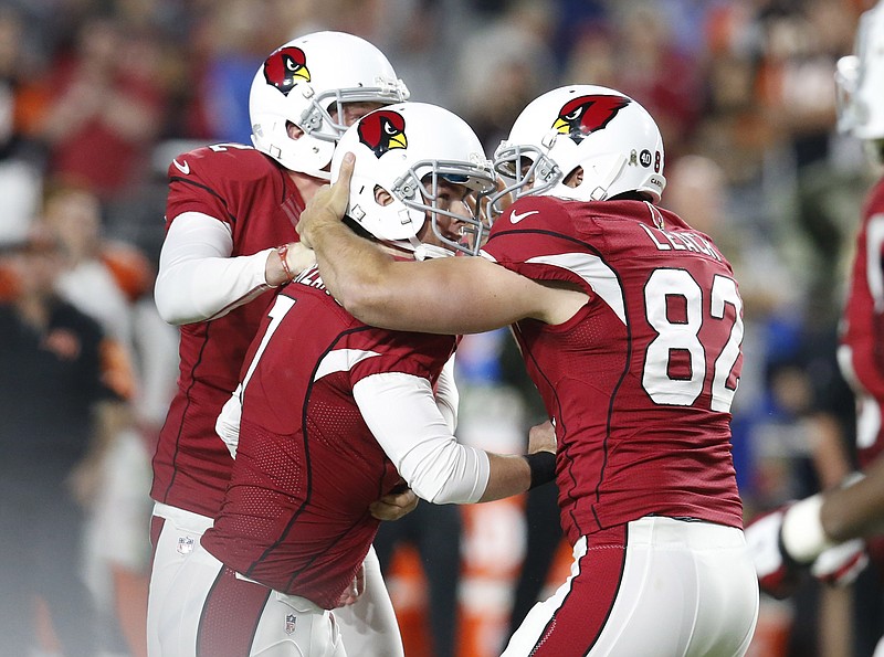Arizona Cardinals kicker Chandler Catanzaro (7) celebrates his game-winning field goal with punter Drew Butler (2) and snapper Mike Leach (82) against the Cincinnati Bengals during the second half of an NFL football game Sunday, Nov. 22, 2015, in Glendale, Ariz. The Cardinals won 34-31.