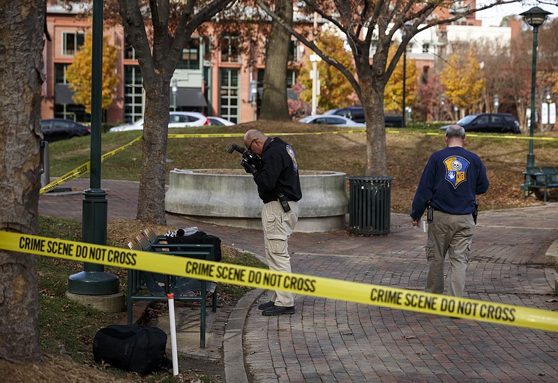 Investigators with the Crime Scene Unit work the scene of an early afternoon shooting in Miller Park on Tuesday, Nov. 24, 2015, in Chattanooga.