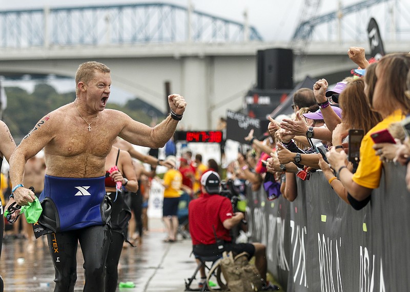 Tom Sullivan cheers after finishing the swim portion of the Ironman Triathlon on Sunday, Sept. 27, 2015, in Chattanooga, Tenn. This marks the second year the triathlon has been held in Chattanooga.