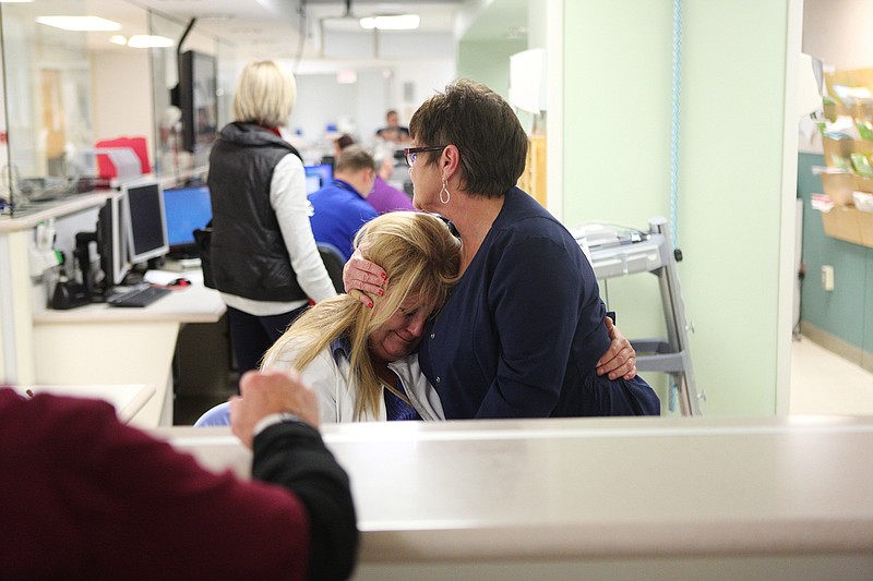 Staff photo by Maura Friedman / Paramedic Sandra Gray, right, comforts RN Katrina Park upon hearing that staff will be laid off at Hutcheson Medical Center on Tuesday in Fort Oglethorpe, Ga.