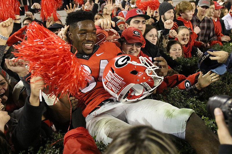 Georgia outside linebacker Leonard Floyd celebrates with fans after last Saturday's 23-17 overtime win over Georgia Southern.