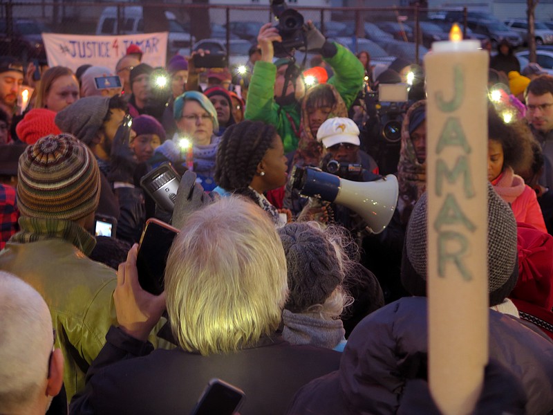 
              File- This Nov. 20, 2015, file photo shows Minneapolis NAACP leader Nekima Levy-Pounds speaking at a prayer vigil n Minneapolis. Five people have been shot near the site of an ongoing protest over the fatal shooting of a black man by a police officer, a Minneapolis Police Department spokesman said. Spokesman John Elder told The Associated Press in an email just before midnight Monday that five people were shot. All five have injuries that are not life-threatening, he said. (AP Photo/Greg Moore, File)
            