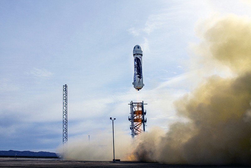 
              In this photo provided by Blue Origin taken on Monday, Nov. 23, 2015, an unmanned Blue Origin rocket blasts off in West Texas. The private company announced Tuesday, Nov. 24, that it had gotten the rocket to land gently enough to be used again, a first in aeronautics.  In Monday’s flight, the capsule reached a height of about 62.5 miles after separating from the booster. The capsule parachuted back to Earth. (Blue Origin via AP)
            