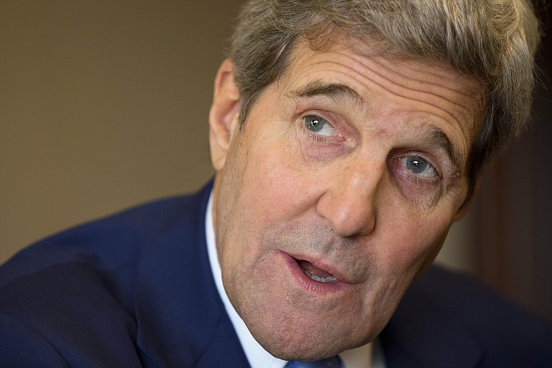 
              U.S. Secretary of State John Kerry speaks with members of the traveling press during his stop in Abu Dhabi, United Arab Emirates, on Monday, Nov. 23, 2015. (AP Photo/Jacquelyn Martin, Pool)
            