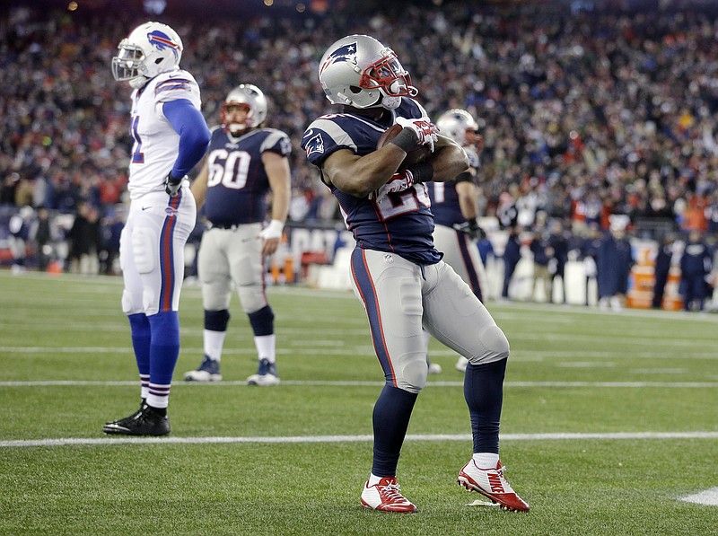 
              New England Patriots running back James White (28) celebrates his touchdown against the Buffalo Bills in the second half of an NFL football game, Monday, Nov. 23, 2015, in Foxborough, Mass. (AP Photo/Steven Senne)
            