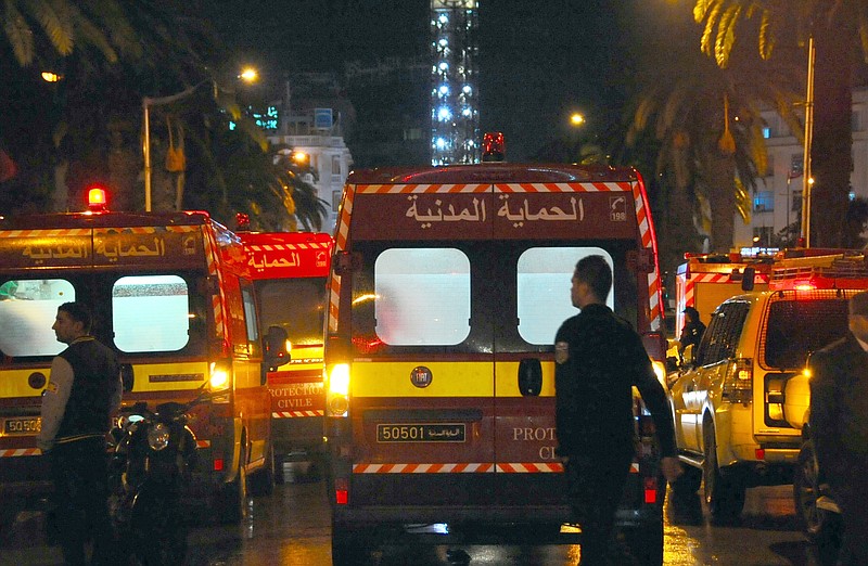 
              Ambulances and police vans are seen at the scene of a bus explosion in the center of the capital, Tunis, Tunisia, Tuesday, Nov. 24, 2015. An explosion hit a bus carrying members of Tunisia’s presidential guard in the country’s capital Tuesday, killing at least 12 people in what the Interior Ministry called a “terrorist act”. (AP Photo/Hassene Dridi)
            