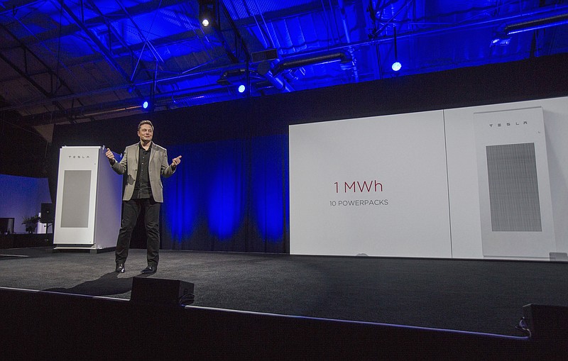 
              FILE - In this April 30, 2015 file photo, Tesla Motors Inc. CEO Elon Musk unveils the company’s newest product, Powerpack in Hawthorne, Calif. Musk is trying to steer his electric car company's battery technology into homes and businesses as part of an elaborate plan to reshape the power grid with millions of small power plants made of solar panels on roofs and batteries in garages. One of the key technologies that could help wean the globe off fossil fuel is probably at your fingertips or in your pocket right now: the battery.  If batteries can get better, cheaper and store more power safely, then electric cars and solar- or wind- powered homes become more viable _ even on cloudy days or when the wind isn’t blowing. These types of technological solutions will be one of the more hopeful aspects of United Nations climate talks that begin next week in Paris. (AP Photo/Ringo H.W. Chiu, File)
            