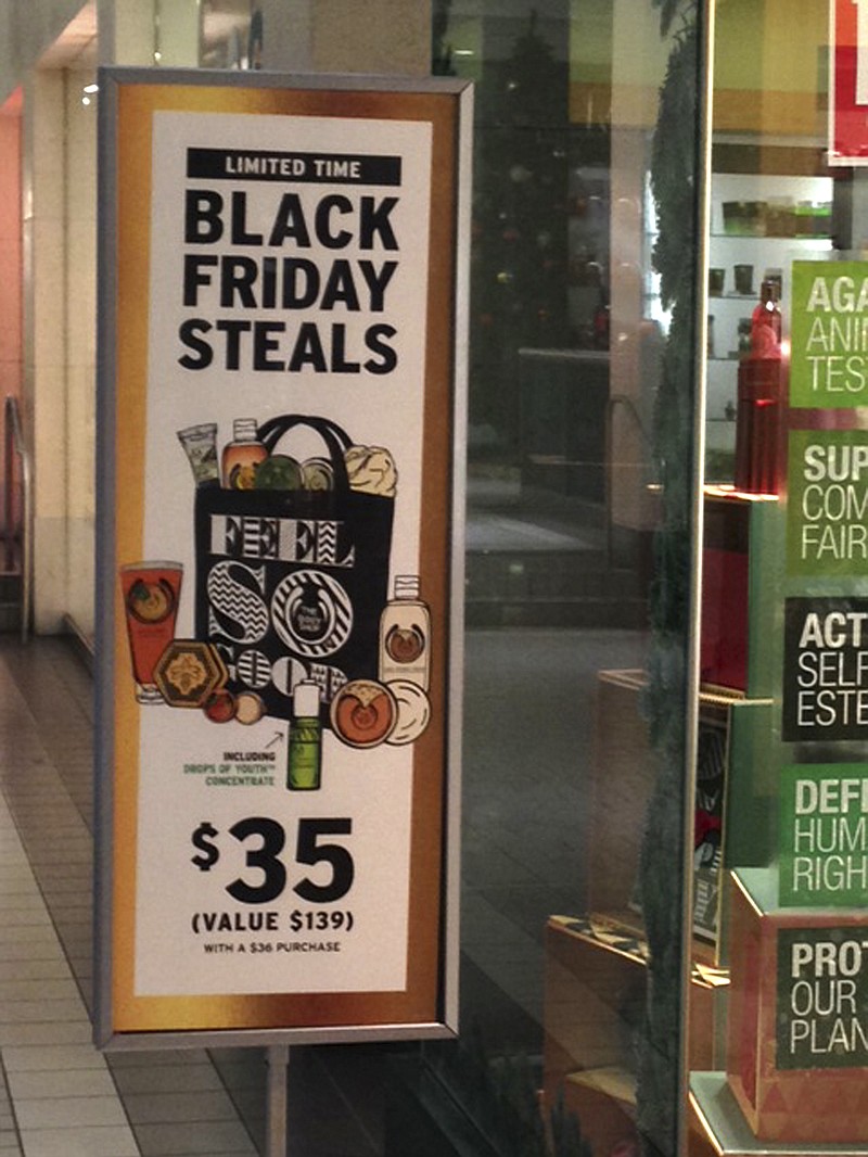 
              In this photo taken Tuesday, Nov. 24, 2015, sale signs for Black Friday are seen at the Fifth Avenue Mall in downtown Anchorage, Alaska. While Alaskans living in bigger cities can take part in madness in the nation's biggest shopping day, Black Friday in rural Alaska doesn’t mean long lines and pushy shoppers ready to do battle for sweet deals. (AP Photo/Rachel D'Oro)
            