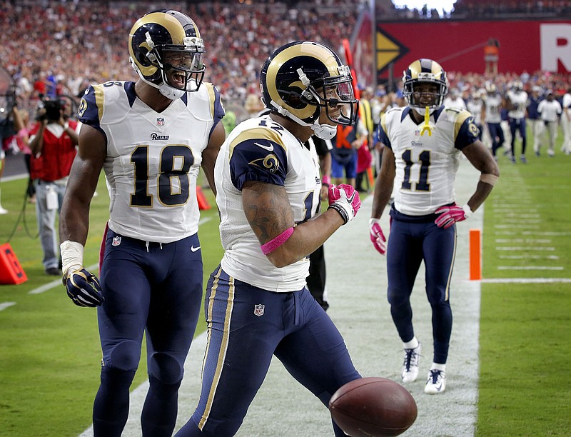
              FILE - In this Oct. 4, 2015, file photo, St. Louis Rams wide receiver Stedman Bailey (12) celebrates his touchdown reception with teammates Kenny Britt (18) and Tavon Austin (11) during the second half of an NFL football game against the Arizona Cardinals in Glendale, Ariz. A person familiar with the situation told The Associated Press on condition of anonymity because details have not been released by the Rams, that Bailey was shot on Tuesday, Nov. 24. (AP Photo/Ross D. Franklin, File)
            