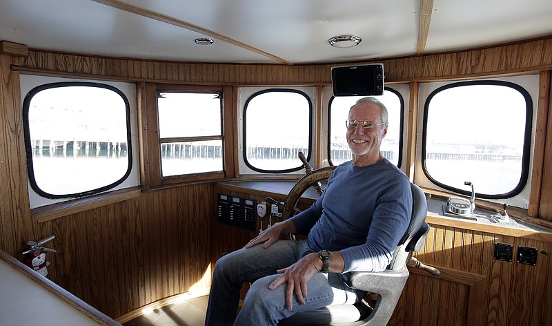 
              In this Thursday, Nov. 19, 2015, photo, Phil Cruver, CEO of Catalina Sea Ranch, poses for a picture aboard the Captain Jack in San Pedro, Calif. Some 90 percent of seafood consumed by Americans is imported, a fact that the Obama administration vowed to start turning around by expanding fish and shellfish farms into federal waters. Yet nearly two years since the first permit was issued, the United States still has no offshore farms. (AP Photo/Chris Carlson)
            
