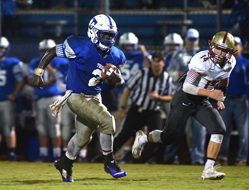Trion's Malik Martin (2) breaks into the open for a big Bulldog gain.  The Christian Heritage Lions visited the Trion Bulldogs in GHSA football action Friday October 2, 2015.
