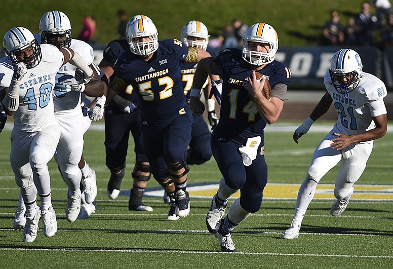 UTC quarterback Jacob Huesman breaks into the open field as he runs the ball on Saturday, Nov. 14, 2015, in Chattanooga, Tenn. UTC won by a score of 31-17.