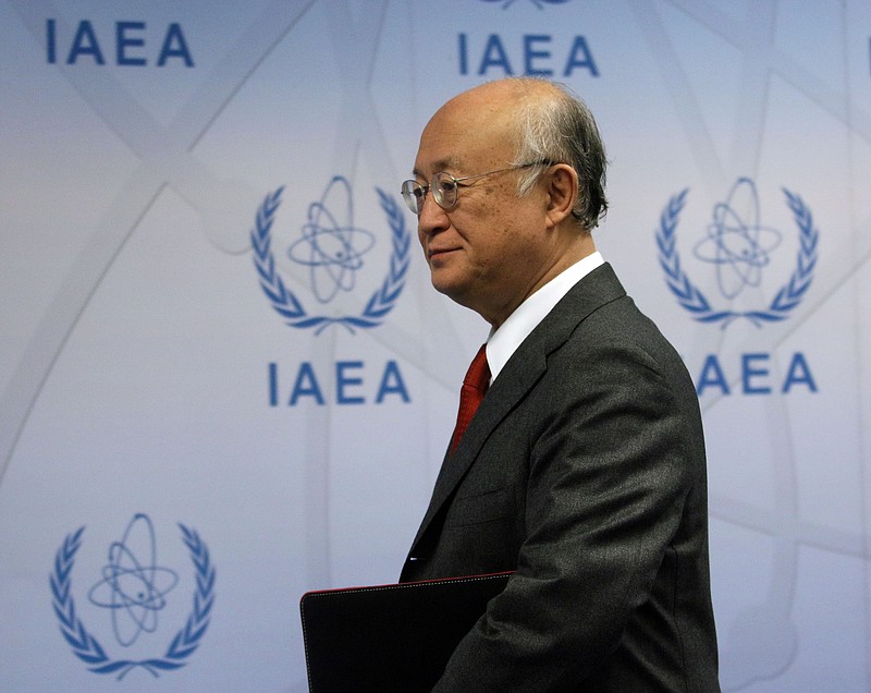 
              Director General of the International Atomic Energy Agency, IAEA, Yukiya Amano of Japan arrive to addresses the media for a news conference after a meeting of the IAEA board of governors at the International Center Vienna, Austria, Thursday, Nov, 26, 2015. (AP Photo/Ronald Zak)
            