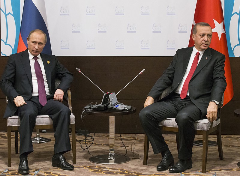 
              FILE - In this file photo taken on Monday, Nov.  16, 2015, Russian President Vladimir Putin, left, and Turkish President Recep Tayyip Erdogan pose for the media before their talks during the G-20 Summit in Antalya, Turkey.  Putin ordered the deployment of long-range air defense missiles to a Russian military base in Syria and Russia‘s military said it would destroy any target that may threaten its warplanes following the downing of a Russian military jet by Turkey. (AP Photo/Alexander Zemlianichenko, file)
            