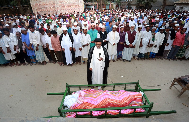 
              Bangladeshi Muslims attend the funeral of a man killed in an attack Thursday on a mosque in Bangladesh's Bogra district, Friday, Nov. 27, 2015. Thursday's attack follows a wave of deadly assaults in 2015 on foreigners, secular writers and the Shiite community in the Sunni majority nation. (AP Photo)
            