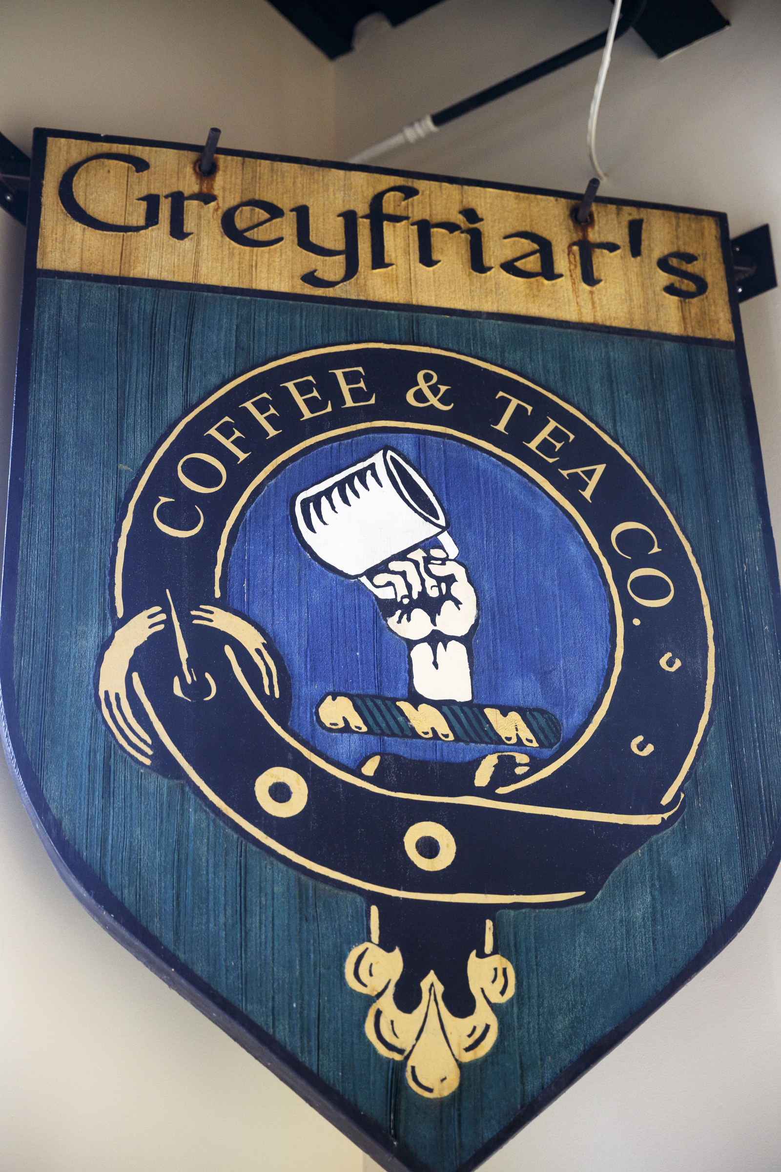 The old exterior sign hangs at Greyfriar's Coffee & Tea Co. on Friday, Nov. 27, 2015, in Chattanooga, Tenn. The Chattanooga coffee house moved from its location on Broad Street to Market Street adjacent to the Sports Barn.