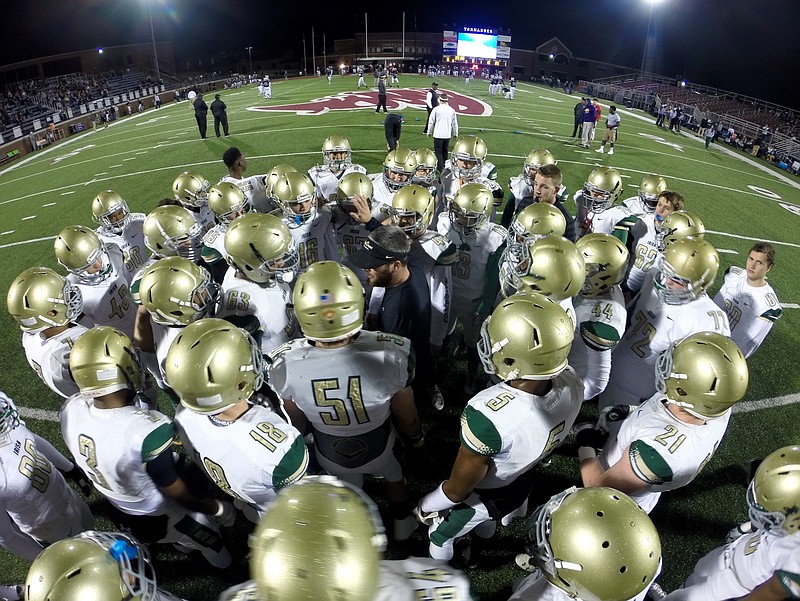Staff Photo by Dan Henry / The Chattanooga Times Free Press- 11/27/15. Notre Dame High School defensive  coach Chandler Tygard motivates his team before playing Alcoa High School during the class 3A football semifinal game at the Tornado's home field in Alcoa Tennessee on Friday, November 27, 2015.