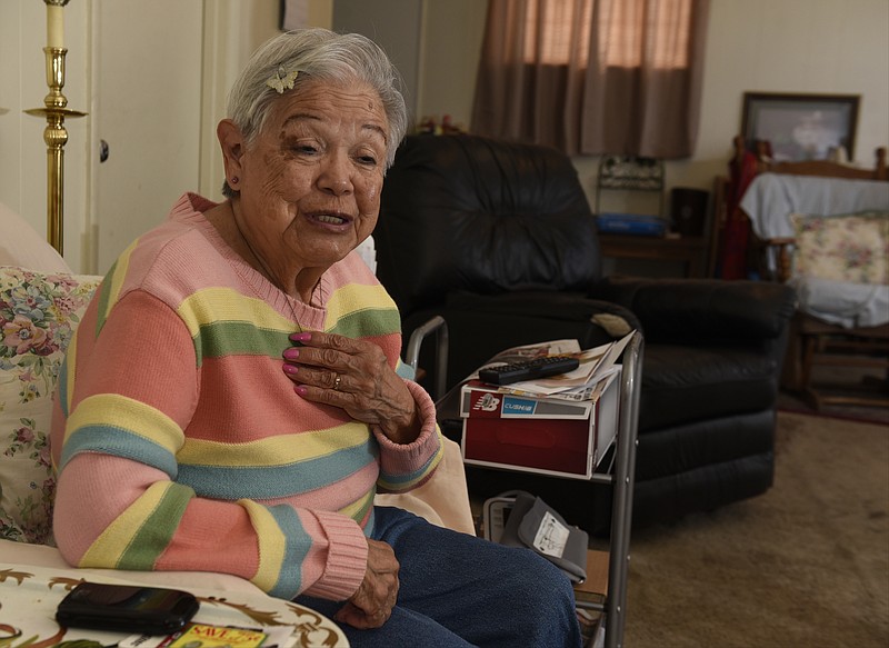 Betty Padilla is photographed in her apartment on Tuesday, Nov. 24, 2015, in East Ridge, Tenn. Behind on her electric bill, her power was turned off this summer. The Partnership has helped her keep her power on, but she now has another disconnection notice. 