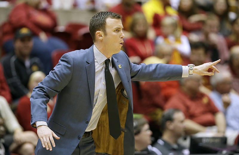 Chattanooga head coach Matt McCall directs his team during the first half of an NCAA college basketball game against Iowa State, Monday, Nov. 23, 2015, in Ames, Iowa. (AP Photo/Charlie Neibergall)