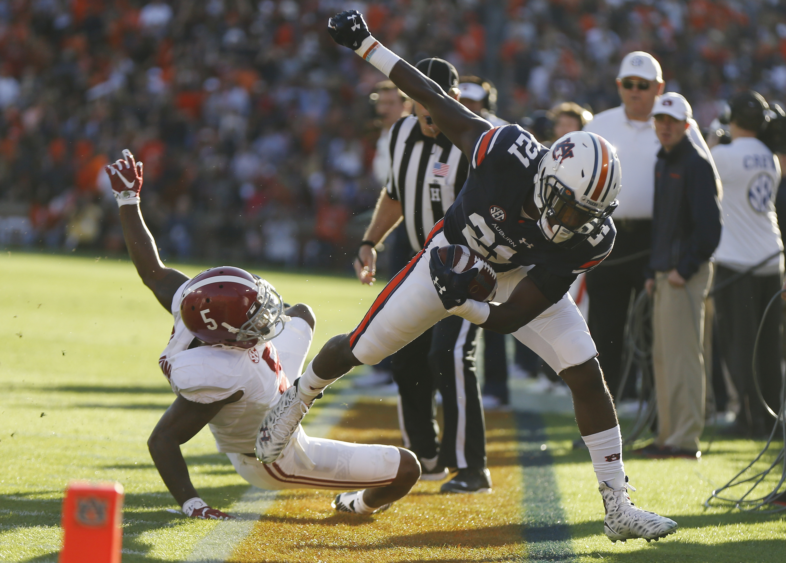 Alabama defensive back Cyrus Jones (5) tackles Auburn running back Kerryon Johnson (21) during an NCAA college football game, Saturday, Nov. 28, 2015, in Auburn, Ala. (AP Photo/Gerald Herbert)