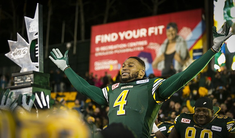 Edmonton Eskimos' Adarius Bowman celebrates after the Eskimos won the Canadian Football League's West Division final over the Calgary Stampeders in Edmonton, Alberta, on Sunday, Nov. 22, 2015. (Jeff McIntosh/The Canadian Press via AP)