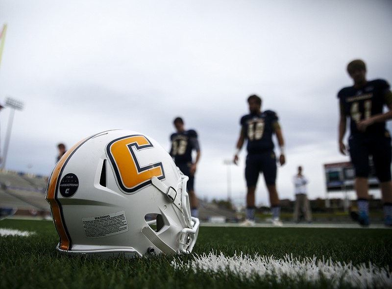A UTC helmet rests on the ground during warmups before the Mocs' FCS playoff football game against Fordham at Finley Stadium on Saturday, Nov. 28, 2015, in Chattanooga, Tenn.