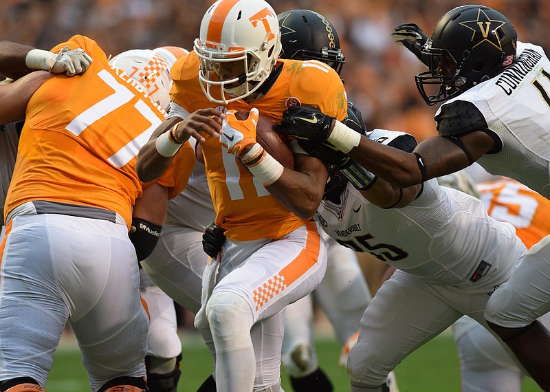 Tennessee quarterback Joshua Dobbs (11) goes the center of the line for a Tennessee touchdown.  The Vanderbilt Commodores visited the Tennessee Volunteers in SEC football action November 28, 2015.