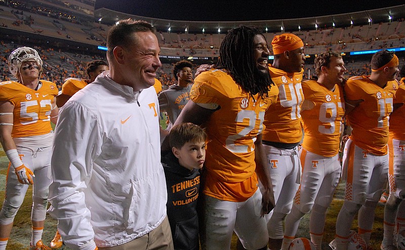 Tennessee head coach Butch Jones, and son Andrew, join Jalen Reeves-Maybin (21) and the other Volunteers for the bands's playing of the Tennessee Waltz.  The Vanderbilt Commodores visited the Tennessee Volunteers in SEC football action November 28, 2015.
