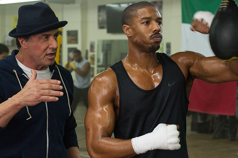 
              This photo provided by Warner Bros. Pictures shows Michael B. Jordan, right, as Adonis Johnson and Sylvester Stallone as Rocky Balboa in Metro-Goldwyn-Mayer Pictures', Warner Bros. Pictures' and New Line Cinema's drama "Creed," a Warner Bros. Pictures release. The movie opened in U.S. theaters on Nov. 25, 2015. (Barry Wetcher/Warner Bros. Pictures via AP)
            