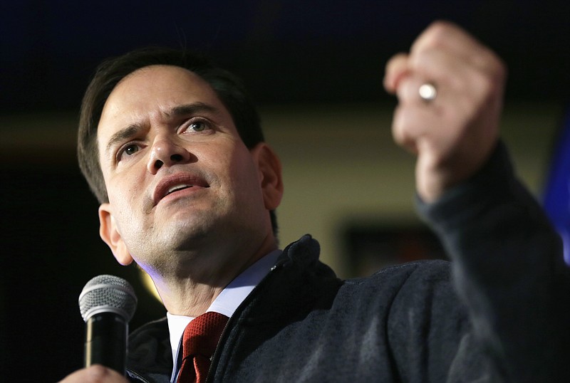 
              FILE - In this Nov. 11, 2105 file photo, Republican presidential candidate, Sen. Marco Rubio, R-Fla. speaks in Davenport, Iowa.  The Paris attacks have renewed debate on the U.S. government's post-Sept. 11 domestic surveillance laws.  Rubio, earlier this year, sided with top Republican senators in trying unsuccessfully to extend the existing program.  (AP Photo/Charlie Neibergall, File)
            