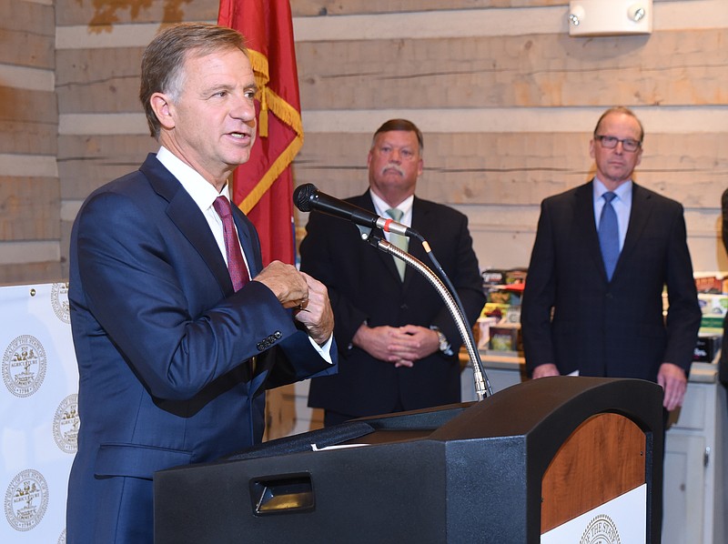 Inside the Tennessee Welcome Center on Interstate 75, Gov. Bill Haslam speaks recently about possible solutions for the Interstate 75/I-24 junction project. Hamilton County Mayor Jim Coppinger, center, and Tennessee Department of Transportation Commissioner John Schroer listen.
