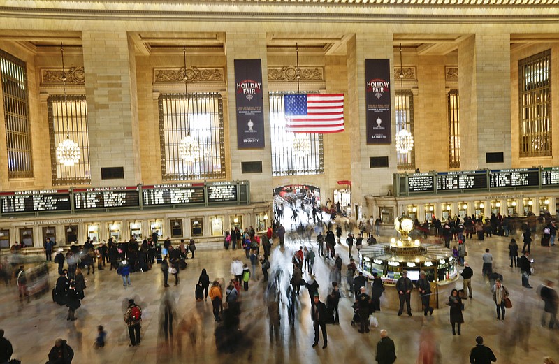 
              FILE - In this Nov. 25, 2015 file photo, people move about Grand Central Station in New York. According to AAA, 42 million traveled somewhere to celebrate Thanksgiving. Tens of millions of Americans returning home after the long Thanksgiving holiday weekend Sunday have cooperative weather and mostly efficient airport operations to thank for smooth traveling conditions. (AP Photo/Frank Franklin II, File)
            