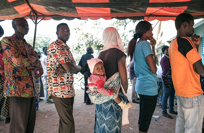 
              Voters queue before casting their ballots, during elections in Ouagadougou, Burkina Faso, Sunday, Nov. 29, 2015. Hundreds of voters lined up after morning prayers to vote Sunday in Burkina Faso's first presidential and legislative elections since a popular uprising toppled the West Africa nation's longtime leader last year.(AP Photo/Theo Renaut)
            