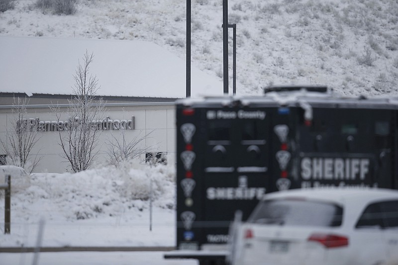 
              Police investigate at a Planned Parenthood clinic and area around the building north of a strip mall early Saturday, Nov. 28, 2015, in northwest Colorado Springs, Colo. A gunman who opened fire inside a Planned Parenthood clinic was arrested Friday after engaging in gun battles with authorities during an hourslong standoff that killed three people and wounded nine others, officials said. (AP Photo/David Zalubowski)
            