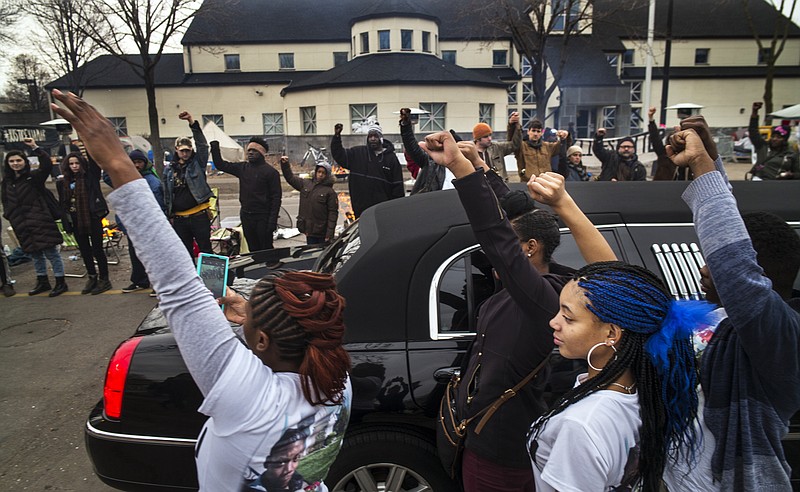 
              FILE - In a Wednesday, Nov. 25, 2015 file photo, family members of Jamar Clark get out of a limousine to show show support for the Black Lives Matter supporters as Clark's the funeral procession passed by the Minneapolis Police Department’s 4th Precinct, in Minneapolis. Clark's death in a confrontation with police has sparked more than a week of protests. Activists have demanded not just answers in the investigation but public policy changes to address issues of economic injustice. (Richard Tsong-Taatarii/Star Tribune via AP, File)  MANDATORY CREDIT; ST. PAUL PIONEER PRESS OUT; MAGS OUT; TWIN CITIES LOCAL TELEVISION OUT
            