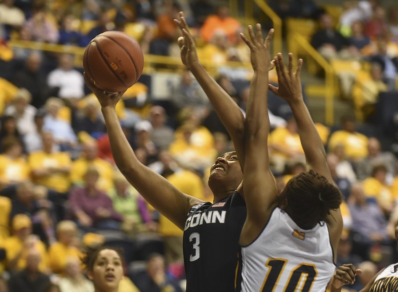 Connecticut's Morgan Tuck is guarded by UTC's Queen Alford in the game Monday, Nov. 30, 2015, at McKenzie Arena.