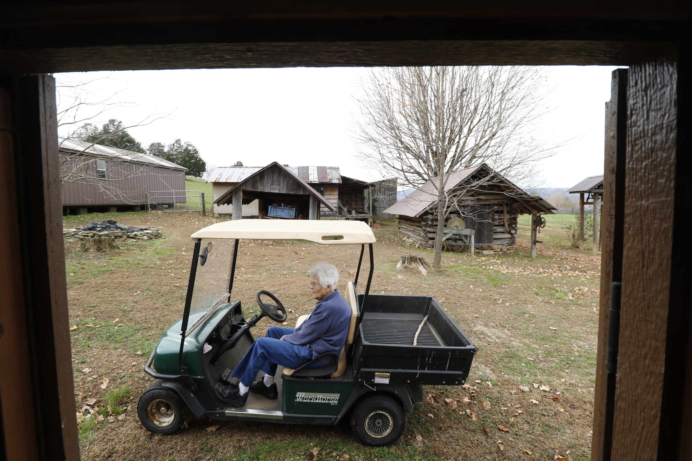 Staff Photo by Dan Henry / The Chattanooga Times Free Press- 11/25/15. Nadean Kell, makes her way to a shed that houses miniature replicas of structures that her late husband Thaxton Kell built depicting the Sequatchie Valley and surrounding areas.