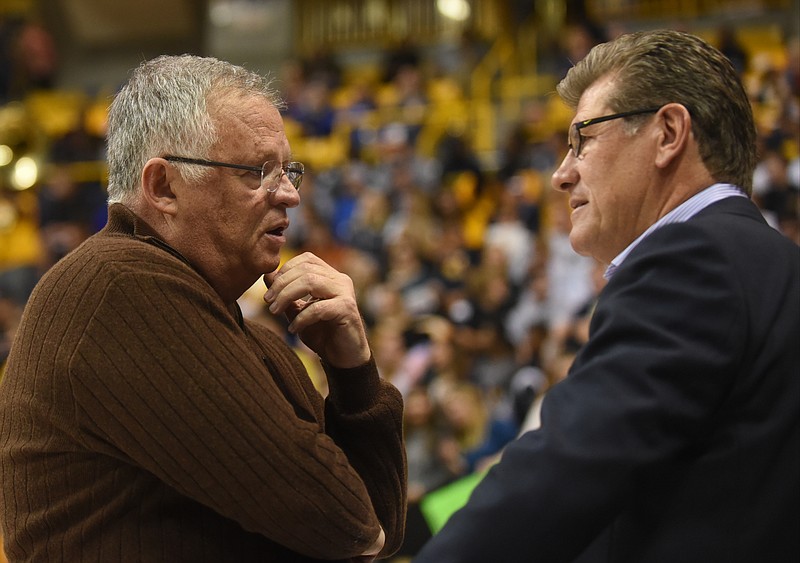 UTC coach Jim Foster and Connecticut coach Geno Auriemma before the game Monday, November 30, 2015 at McKenzie Arena.