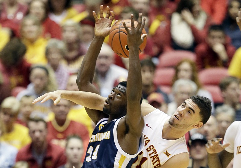 Iowa State forward Georges Niang, right, tries to steal the ball from Chattanooga guard Casey Jones during the second half of an NCAA college basketball game, Monday, Nov. 23, 2015, in Ames, Iowa. (AP Photo/Charlie Neibergall)