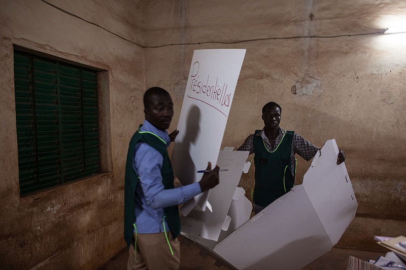 
              Election officials start clearing a polling station after elections in Ouagadougou, Burkina Faso, Sunday, Nov. 29, 2015. Hundreds of voters lined up after morning prayers to vote Sunday in Burkina Faso's first presidential and legislative elections since a popular uprising toppled the West Africa nation's longtime leader last year.(AP Photo/Theo Renaut)
            