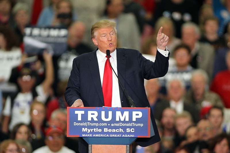 
              FILE - In this file photo taken on Nov. 24, 2015, Republican presidential candidate Donald Trump speaks during a campaign event at the Myrtle Beach Convention Center in Myrtle Beach, S.C. Some leading Republican presidential candidates seem to view Muslims as fair game for increasingly harsh words they might not dare use against any other group for fear of the political cost. So far, that strategy is winning support from conservatives influential in picking the nominee.  Since the attacks that killed 130 people in Paris, GOP front-runner Trump has said he wants to register all Muslims in the U.S. and surveil American mosques. He has repeated unsubstantiated claims that Muslim-Americans in New Jersey celebrated by the “thousands” when the World Trade Center was destroyed on Sept. 11, 2001. (AP Photo/Willis Glassgow, File)
            