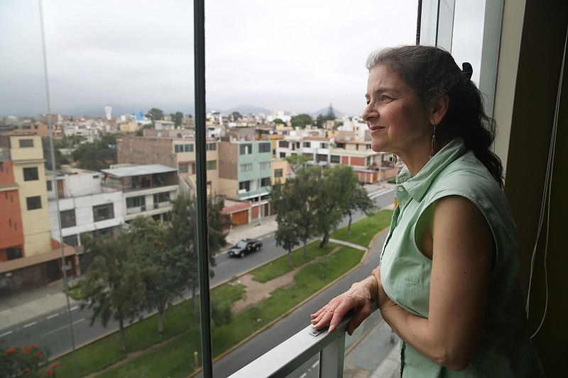 
              In this Friday, Nov 27, 2015 photo, U.S. activist Lori Berenson looks out from her residence in Lima, Peru. Berenson is heading home to New York,  two decades after being found guilty of aiding leftist rebels. The 46-year-old has been living quietly in Lima with her 6-year-old son since her 2010 parole. She’s been barred from leaving the country until her 20-year sentence lapsed. (AP Photo/Martin Mejia)
            