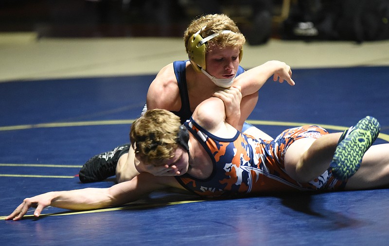 Soddy-Daisy's Landon Wheaton, top, prevents William Blount Austin Sauls from an escape during his 9-6 decision for the win in the 113-pound weight class Tuesday night.