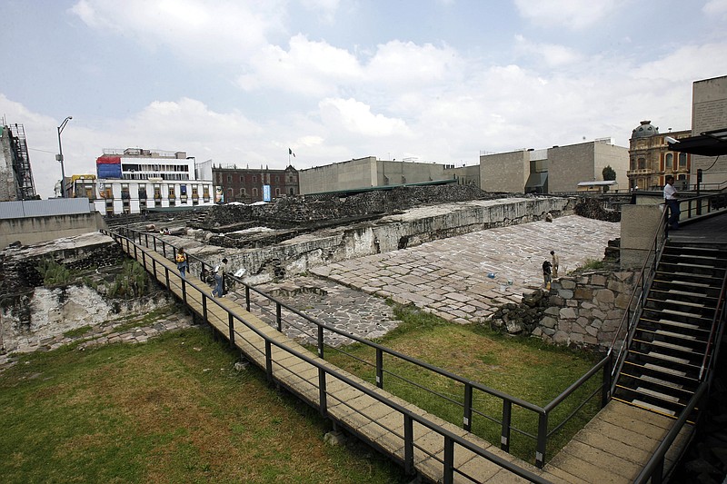 
              In this Oct. 3, 2006 photo, people visit the archaeological site, the Templo Mayor, in Mexico City. A Mexican archaeologist said Monday, Nov. 30, 2015, his team has discovered, at the archaeological site, a long tunnel leading into the center of a circular platform where Aztec rulers were believed to be cremated. The Aztecs are believed to have cremated the remains of their leaders during their 1325-1521 rule, but the final resting place of the cremains has never been found. (AP Photo/ Claudio Cruz, File)
            