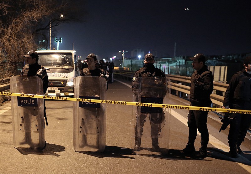 
              Riot police secure the area after an explosion on a highway overpass near a subway station, wounding five people, in Istanbul, Turkey, Tuesday, Dec. 1, 2015. The explosion was caused by a bomb left on barriers on the overpass, according to Atilla Aydiner, the mayor for Istanbul's Bayrampasa district.(AP Photo/Cagdas Erdogan)
            